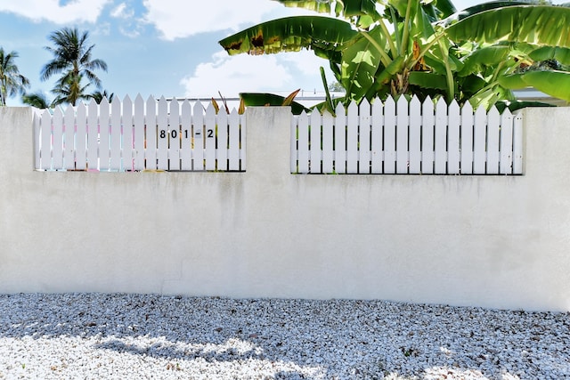 view of gate with fence