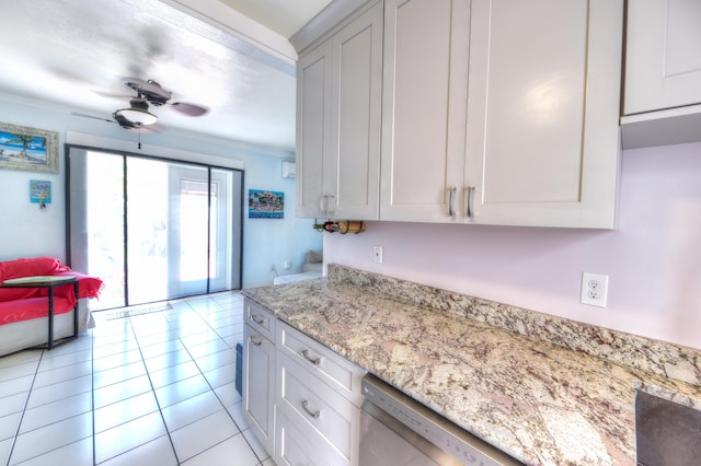 kitchen featuring ceiling fan, light stone counters, light tile patterned flooring, white cabinets, and dishwasher