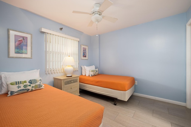 bedroom featuring ceiling fan and baseboards