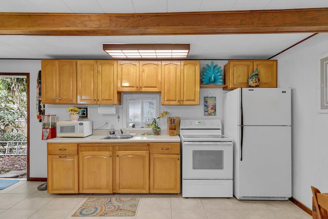 kitchen with light countertops, light tile patterned flooring, a sink, white appliances, and beamed ceiling