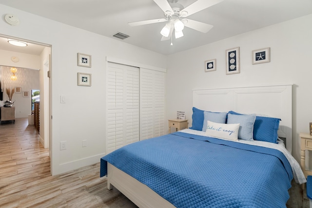 9812 Windward Ave, Key Largo, FL 33037 - bedroom featuring light wood-type flooring, a closet, and a ceiling fan