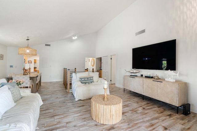 9812 Windward Ave, Key Largo, FL 33037 - living area with light wood-type flooring and high vaulted ceiling