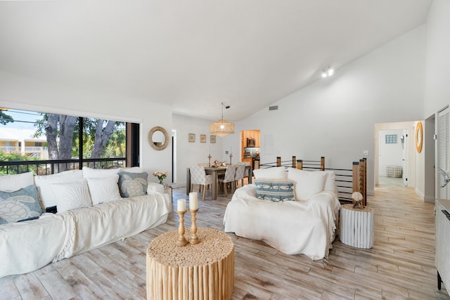9812 Windward Ave, Key Largo, FL 33037 - living area with light wood finished floors and high vaulted ceiling