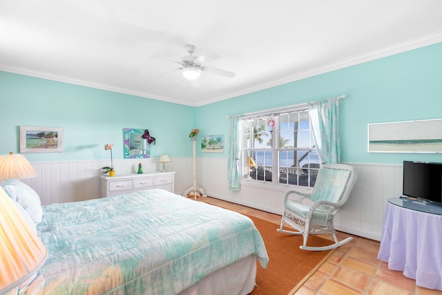 bedroom with ornamental molding and ceiling fan