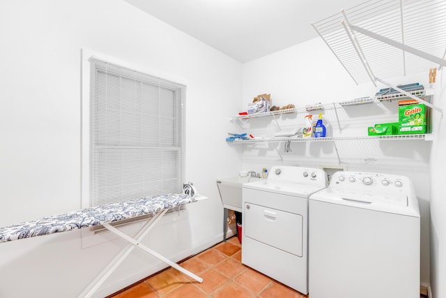 washroom featuring separate washer and dryer and light tile patterned floors