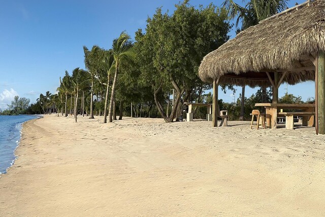 exterior space with a gazebo and a view of the beach