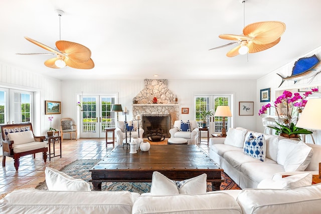 living room featuring ceiling fan, french doors, and a healthy amount of sunlight