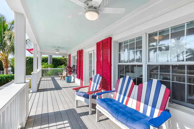 wooden deck featuring ceiling fan and a porch