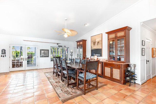 tiled dining room featuring crown molding, vaulted ceiling, ceiling fan, and french doors