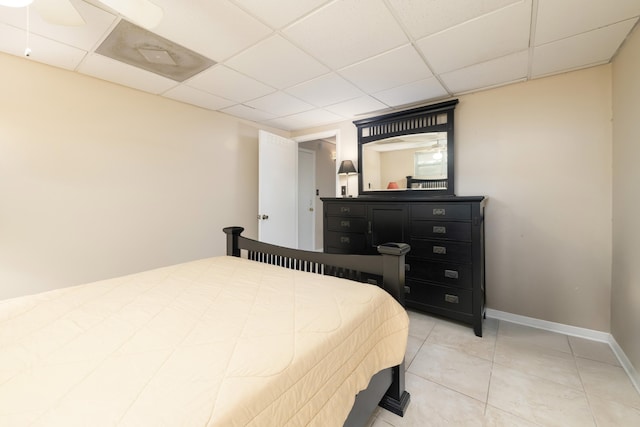 tiled bedroom with a drop ceiling