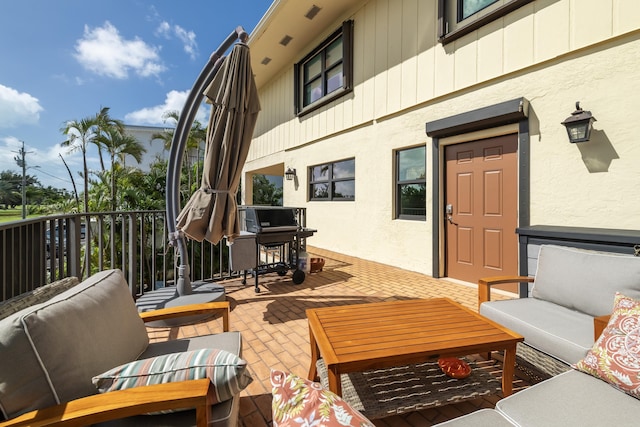 view of patio / terrace with a balcony and outdoor lounge area