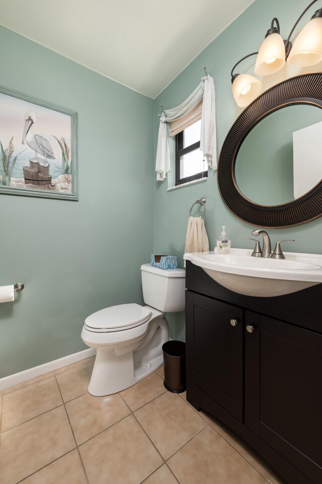 bathroom with vanity, tile patterned floors, and toilet