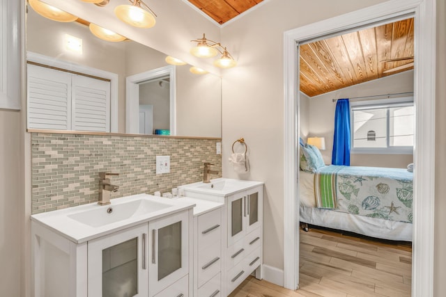 176 Iroquois Dr, Islamorada, FL 33036 - ensuite bathroom featuring a sink, decorative backsplash, and ensuite bathroom