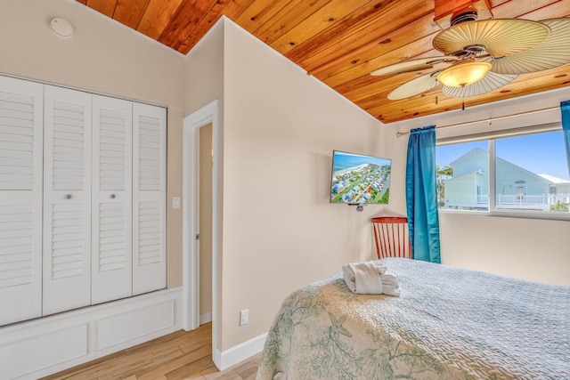 176 Iroquois Dr, Islamorada, FL 33036 - bedroom with a closet, light wood-style flooring, a ceiling fan, wood ceiling, and baseboards
