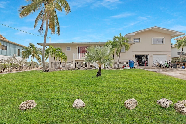 view of front of property featuring a garage and a front yard