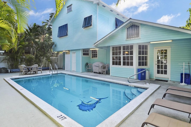 view of swimming pool with a patio