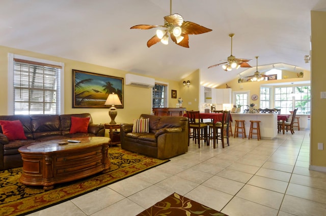 living room with vaulted ceiling, light tile patterned floors, and an AC wall unit