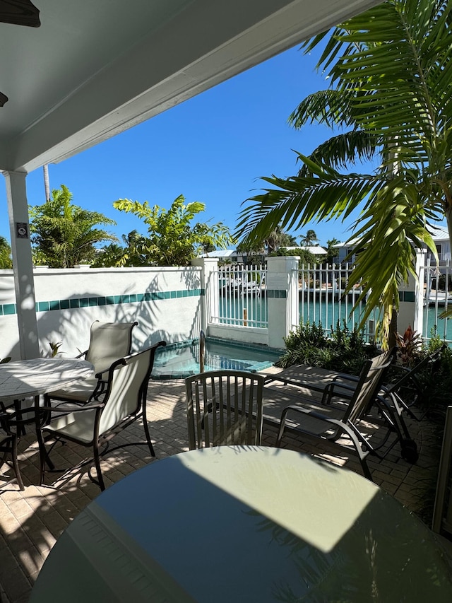 view of patio / terrace featuring a water view