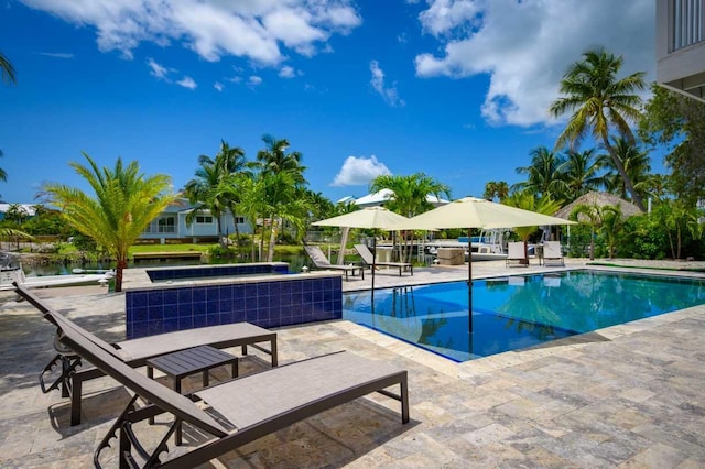 view of swimming pool with a patio