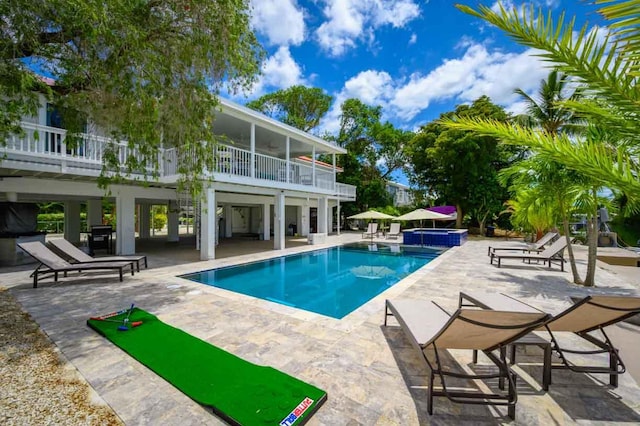 view of swimming pool featuring a patio