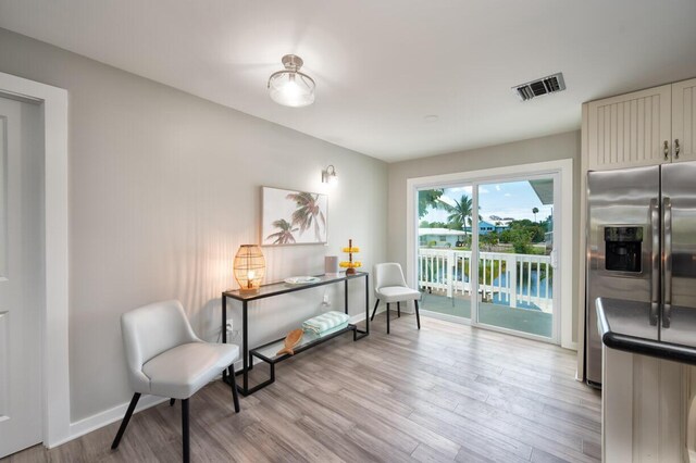 sitting room with light hardwood / wood-style floors