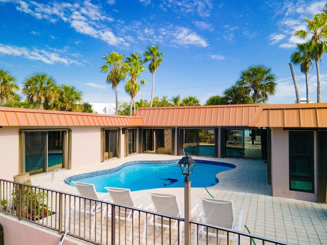 view of swimming pool featuring a patio