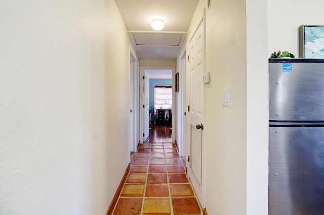 133 Valois Blvd, Key Largo, FL 33037 - hall featuring attic access, baseboards, and tile patterned flooring