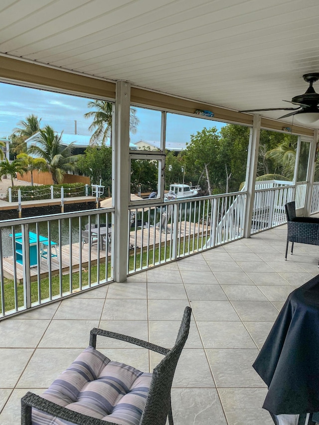 view of patio featuring ceiling fan and a balcony