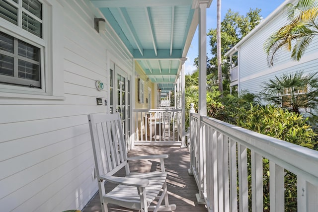 wooden terrace with a porch