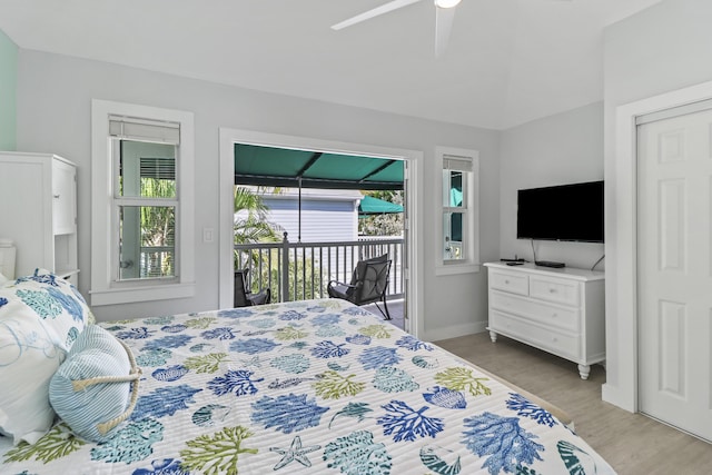 bedroom featuring access to outside, ceiling fan, and light wood-type flooring