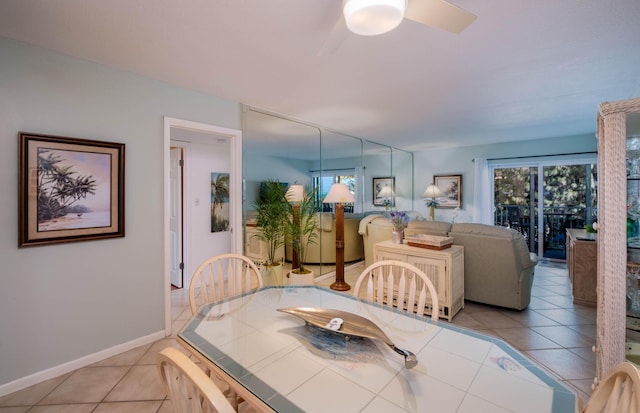 dining area with light tile patterned floors and ceiling fan