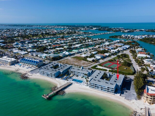 drone / aerial view with a water view and a view of the beach