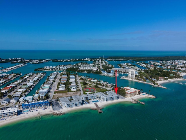 bird's eye view featuring a view of the beach and a water view