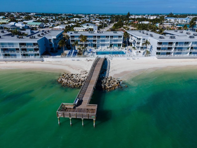 birds eye view of property featuring a view of the beach and a water view