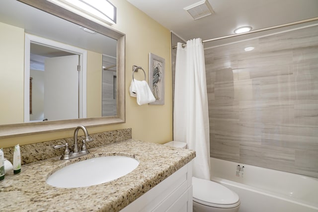 full bathroom featuring vanity, toilet, and shower / bath combo