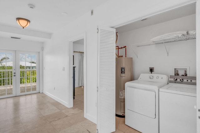 1330 Coury Dr, Key Colony, FL 33051 - laundry room with electric water heater, washing machine and dryer, french doors, and baseboards