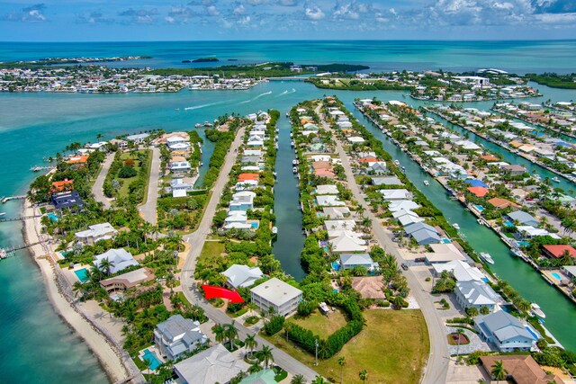 1330 Coury Dr, Key Colony, FL 33051 - aerial perspective of suburban area featuring a large body of water