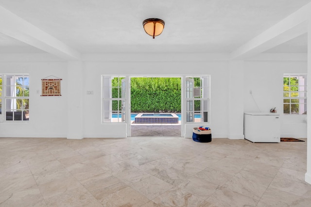 1330 Coury Dr, Key Colony, FL 33051 - empty room featuring healthy amount of natural light and baseboards