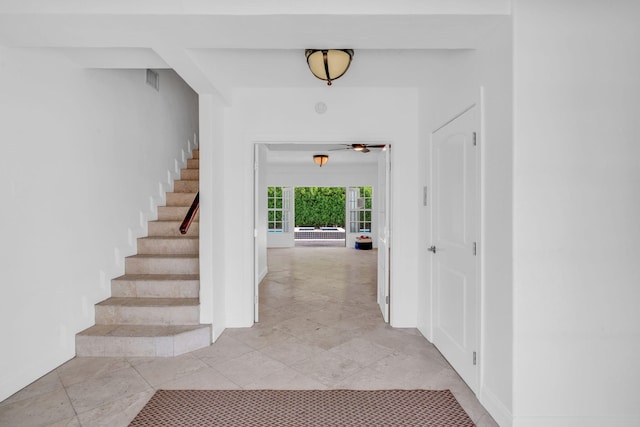 1330 Coury Dr, Key Colony, FL 33051 - entrance foyer featuring stairs, baseboards, and a ceiling fan