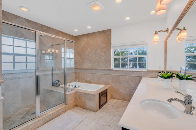 1330 Coury Dr, Key Colony, FL 33051 - full bath with tile walls, a bath, double vanity, a shower stall, and recessed lighting