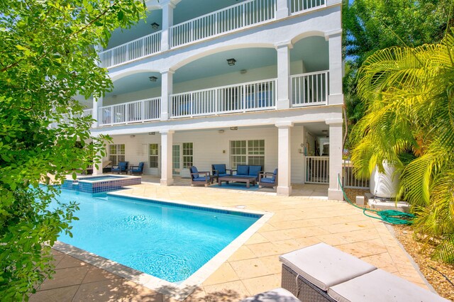 1330 Coury Dr, Key Colony, FL 33051 - view of pool featuring outdoor lounge area, a patio area, and a pool with connected hot tub