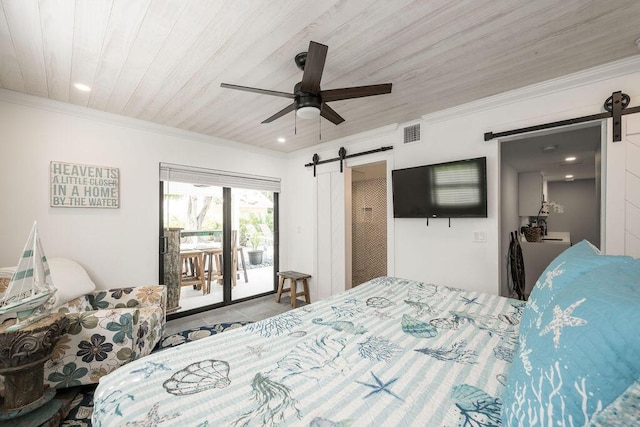 bedroom with ornamental molding, a barn door, and access to exterior