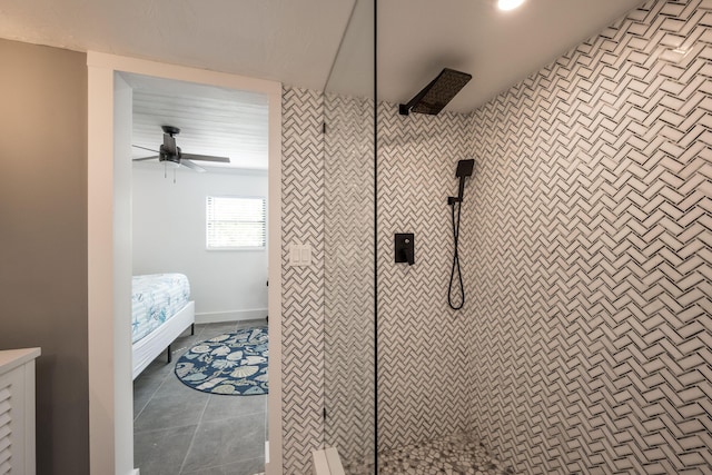 bathroom with ceiling fan, tiled shower, and tile patterned flooring