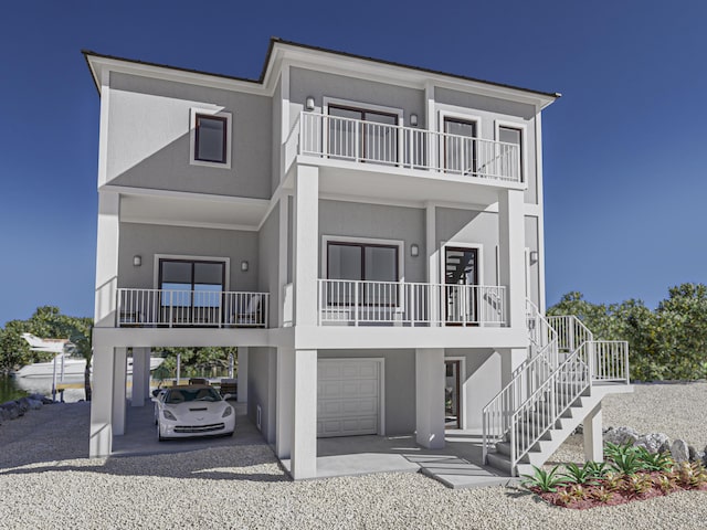 view of front facade with a garage and a balcony