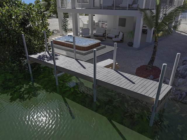 wooden terrace featuring a water view, a covered hot tub, and outdoor lounge area