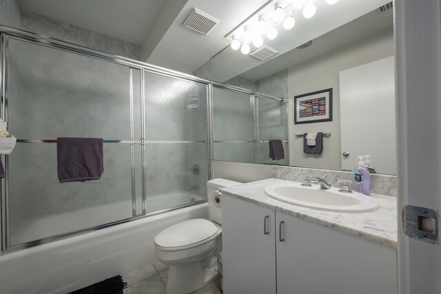 115 Front St Unit 202, Key West, FL 33040 - full bathroom with vanity, toilet, and combined bath / shower with glass door