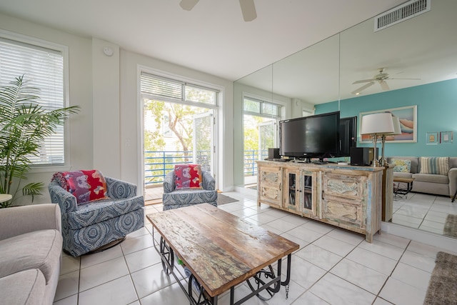 115 Front St Unit 202, Key West, FL 33040 - living room featuring light tile patterned floors, a wealth of natural light, and ceiling fan
