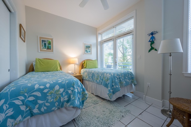 115 Front St Unit 202, Key West, FL 33040 - tiled bedroom featuring ceiling fan