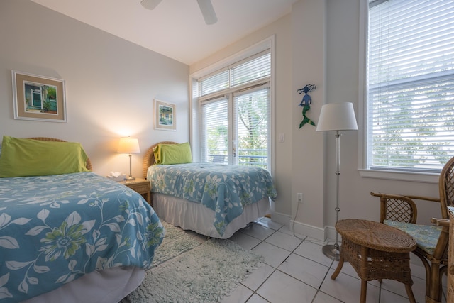 115 Front St Unit 202, Key West, FL 33040 - bedroom featuring ceiling fan, access to exterior, and light tile patterned floors