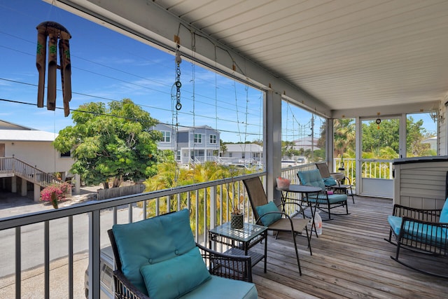wooden terrace featuring a residential view